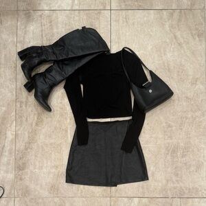 Black High Rise Vegan Leather Mini Skirt from Hollister